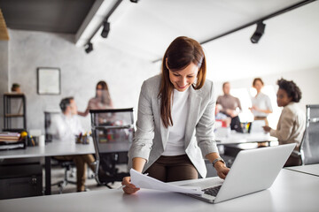 Wall Mural - Business people in the background talking to each other.