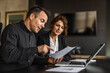© bnenin - Two persons at work, having business plan.