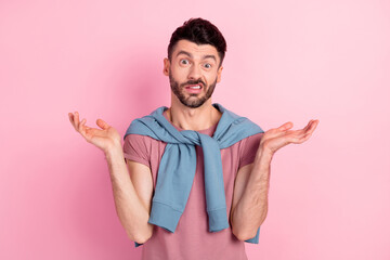 Canvas Print - Photo of young handsome unhappy upset indifferent man shrug shoulders clueless isolated on pink color background