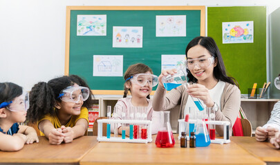 diversity children doing a chemical experiment in laboratory at school. portrait of happy kids at el