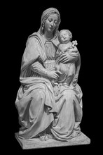 Statue Of The Virgin Mary Carrying The Baby Jesus Isolated On Black Background. Mother Of God Sculpture, Classic Christian Art