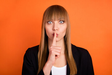 Canvas Print - Photo of impressed nice blond hair lady finger lips wear black jacket isolated on bright orange color background