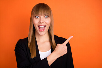 Canvas Print - Photo of impressed nice blond hair lady point empty space wear black jacket isolated on bright orange color background