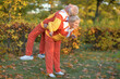 © aletia2011 - happy senior couple doing exercises in autumnal park