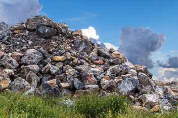 Wall Mural - View of granite heaps and sky clouds.