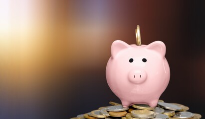 Wall Mural - Piggy bank and coins pile on background