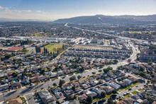 Drone Aerial View Suburban Coastal California Neighborhood. Single Family Homes Near A Park And Ocean