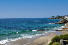 The Laguna Beach Shoreline On A Bright Blue Sky Day.