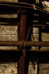 Wall Mural - Rusty chain holding rusty metal pipe with air.