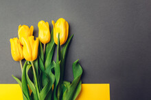 Mother's Day Flowers. Bouquet Of Yellow Tulips On Grey Background. Present, Gift For Spring Holiday. Space