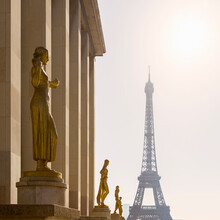 France, Ile-de-France, Paris, Golden Statues Of Palais De Chaillot With Eiffel Tower In Background