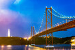 © Ega Birk/Westend61 - Portugal, Lisbon, Ponte 25 de Abril with Christ the King statue illuminated at night