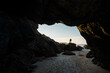 © Manu Prats/Westend61 - Silhouette of man standing on top of rocks at entrance of empty beach cave, Asturias, Spain