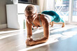 © JOSEP SURIA/Westend61 - Woman practicing plank position while doing workout at home