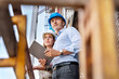 © peter scholl/Westend61 - Male architect holding digital tablet while examining construction site with colleague