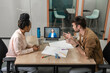 © Vasily Pindyurin/Westend61 - Male and female business people having meeting through video call in boardroom at office