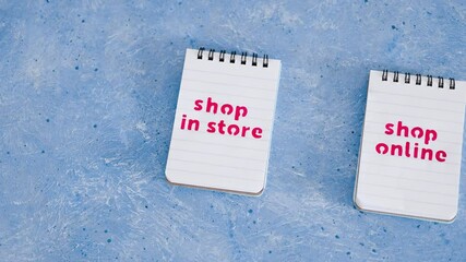 Wall Mural - shop in store vs shop online texts on notepads, competition and retail industry