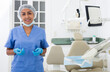 © JackF - Portrait of female dentist in medical center standing near the chair