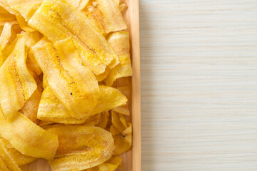 Wall Mural - Banana Chips - fried or baked sliced banana