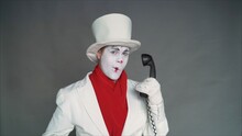 Mime Calls By Phone. Mime With An Old Pipe. Boy-mime With The Phone. Human Emotions. Clown Talking On The Phone.