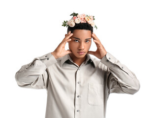 Poster - Portrait of handsome young man with flower wreath on white background