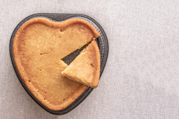 Wall Mural - Heart shaped Lemon Brownie Cake on rustic background.