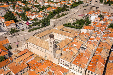 Wall Mural - Aerial drone shot of bell tower coupola of Franciscan church on Stradun street in Dubrovnik old town in Croatia summer