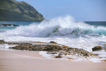 Wall Mural - Big waves at Keawaula Beach Yokohama bay, West coast of Oahu Island, Hawaii. reef or beachrocks on the beach. Leeward Coast. Yokohama, Keawaʻula is the last sandy stretch on the west shore.