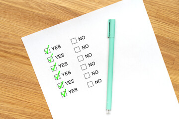 A survey form with yes or no answer options. Questionnaire on white paper, checkboxes ticked