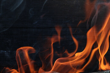 wood background is burning with fire