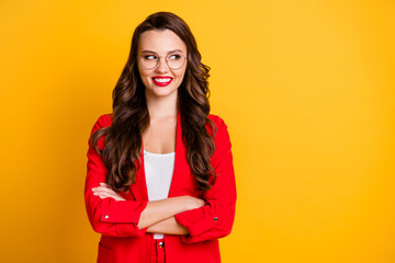 Poster - Portrait of her she nice attractive charming lovely cheerful cheery wavy-haired lady folded arms looking aside copy space isolated over bright vivid shine vibrant yellow color background