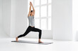 © Drobot Dean - Healthy attractive young yoga woman stretching