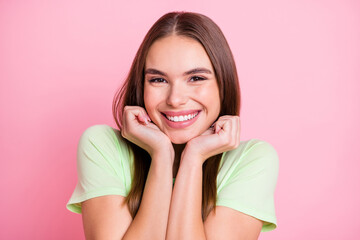 Sticker - Photo of cute funny young girl dressed green t-shirt arms cheeks isolated pastel pink color background