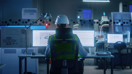 Poster - Industrial Engineer Solving Problems, Working on a Personal Computer, Two Monitor Screens Show CAD Software with 3D Prototype of Eco-Friendly Electric Engine Concept. Back View Shot