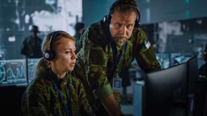 Poster - Military Surveillance Officers Talking Next to a Computer Screen in Central Office for Cyber Operations, Control and Monitoring for Managing National Security, Technology and Army Communications.