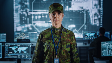 Fototapete - Female Military Officer Posing in Front of the Camera. She in Standing in Surveillance Cyber Operations Office for Managing National Security, Technology and Army Communications.