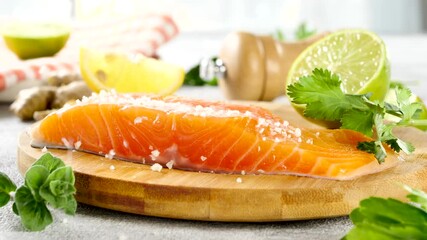 Poster - raw piece of salmon fillet with falling salt and pepper