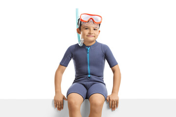 Sticker - Child with a diving mask sitting on a white panel