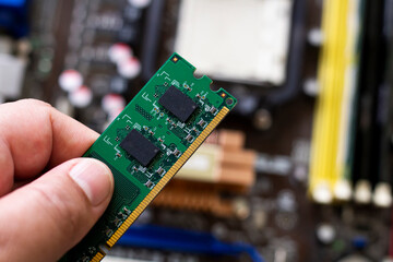 Close up on ram memory with motherboard on blurred background, very short depth of field