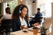 © Vergani Fotografia - black business woman at conference call, talking online in the office. .