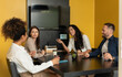 © Vergani Fotografia - brazilian woman talking with co-workers .