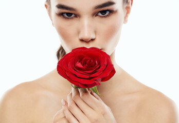 Portrait of a woman with red flower eye shadow on the eyelids eyebrow makeup red lips