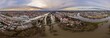 Panorama der Stadt Regensburg in Bayern mit dem Fluss Donau dem Dom und der steinernen Brücke während Hochwasser und Schneeschmelze bei Sonnenuntergang, Deutschland