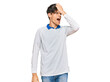 © Krakenimages.com - Young hispanic man wearing casual clothes surprised with hand on head for mistake, remember error. forgot, bad memory concept.