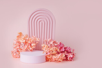 Wall Mural - textured arch with podium and flowers on a pink background. stylish background for cosmetic product 