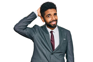 Canvas Print - Young african american man wearing business clothes confuse and wonder about question. uncertain with doubt, thinking with hand on head. pensive concept.