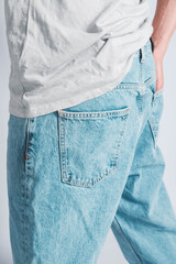 Wall Mural - Back pocket of blue jeans. Man s hand in the back pocket of jeans. Copy, empty space for text