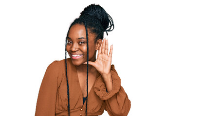 Poster - Young african american woman wearing casual clothes smiling with hand over ear listening an hearing to rumor or gossip. deafness concept.