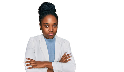 Sticker - Young african american woman wearing business clothes skeptic and nervous, disapproving expression on face with crossed arms. negative person.