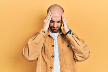 Sticker - Young bald man wearing casual clothes suffering from headache desperate and stressed because pain and migraine. hands on head.